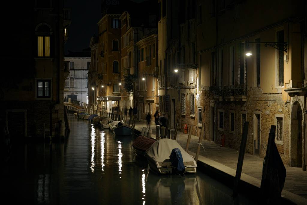 A canal in Venice, at night.